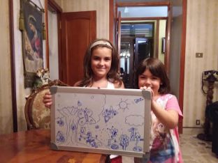Two girls in a family we teach English to. We drew a picture together and taught them the words